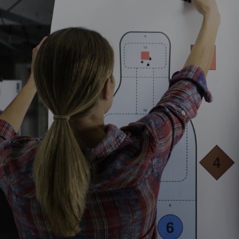 women setting up a gun range