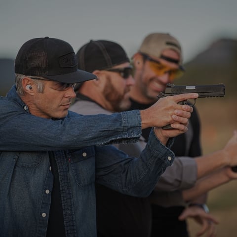 man having gun at a gun club