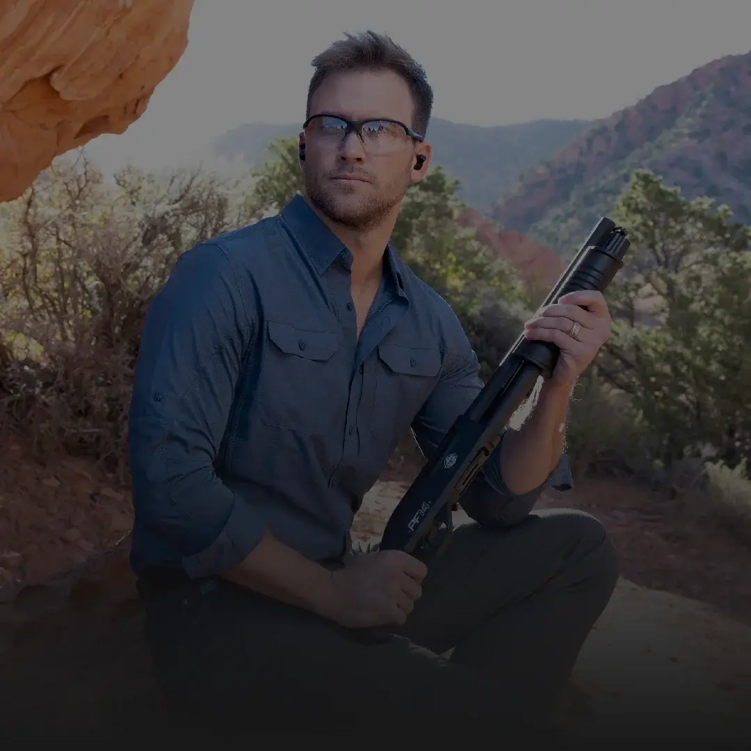 man with a PF14 shotgun